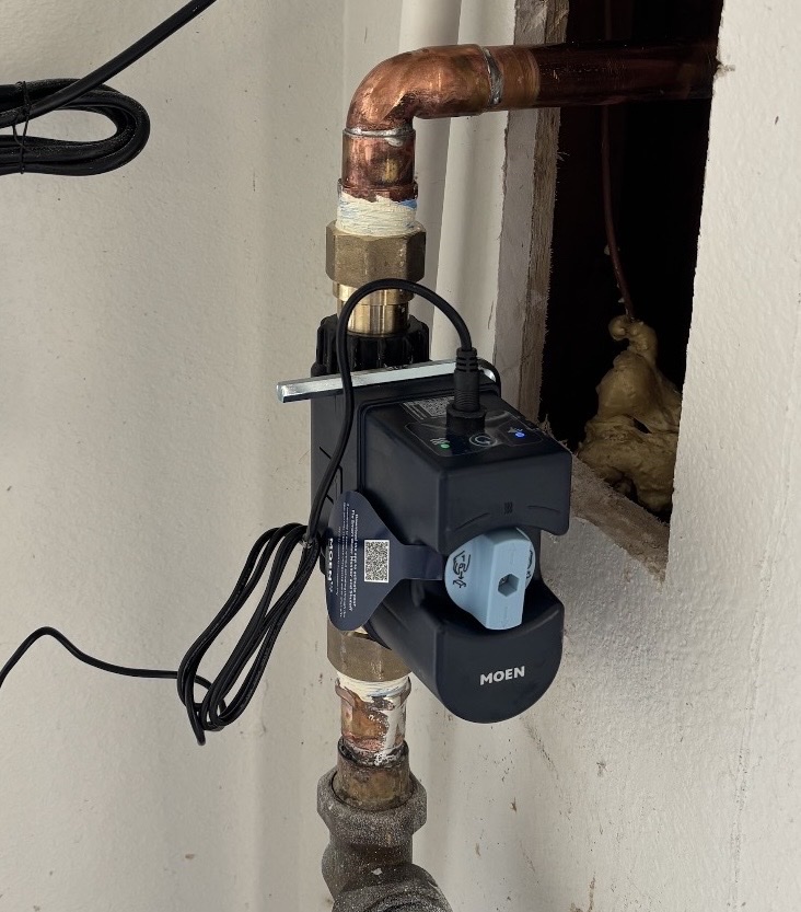Moen Flo smart water shutoff valve mounted on a support bracket on a copper main line in Otay Lakes, Chula Vista