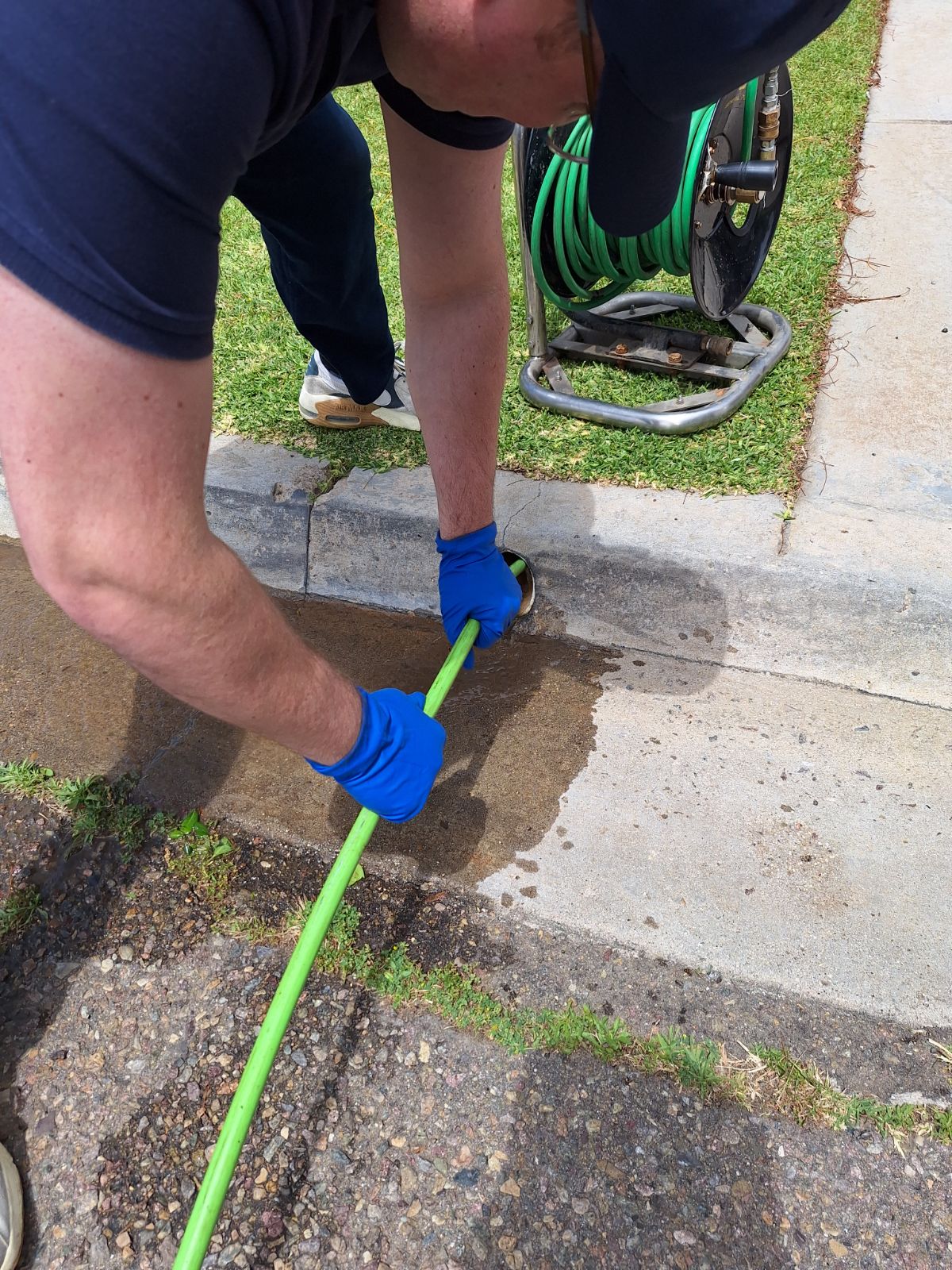 Hydro Hero plumber clearing a clogged drain line through a cleanout in Chula Vista